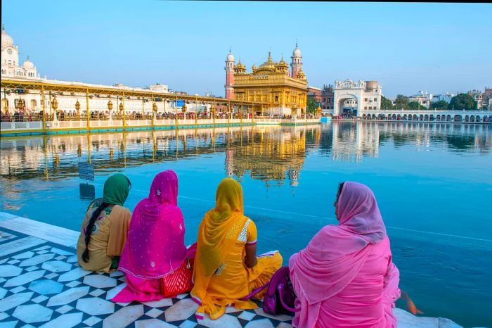 Women gathered by the sacred tank at the Golden Temple in Amritsar