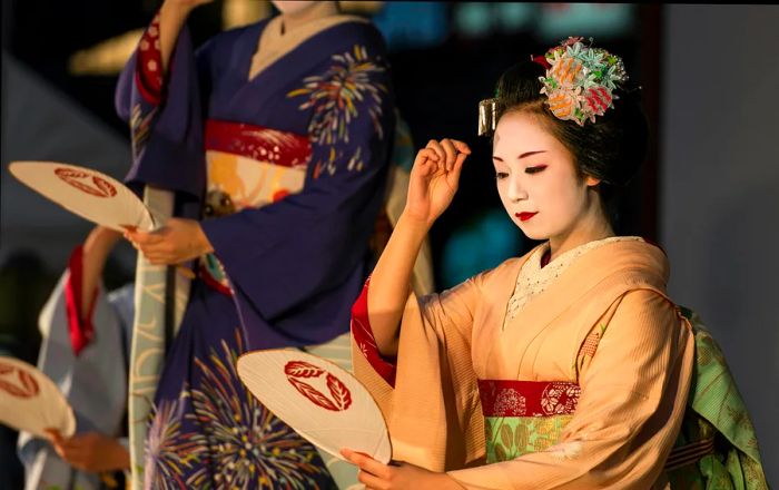 A geisha performer in traditional attire at the Gion Matsuri