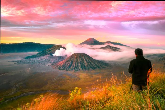 A photographer capturing the beauty of Mount Bromo, Indonesia