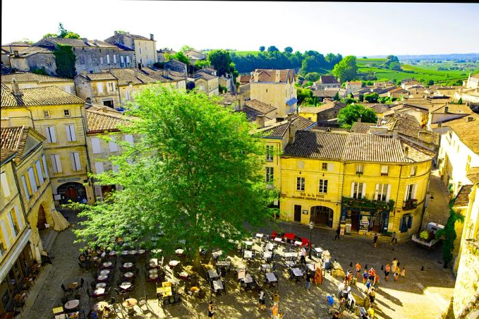 An aerial view showcases a terraced plaza in St-Émilion, Lobourne, France.