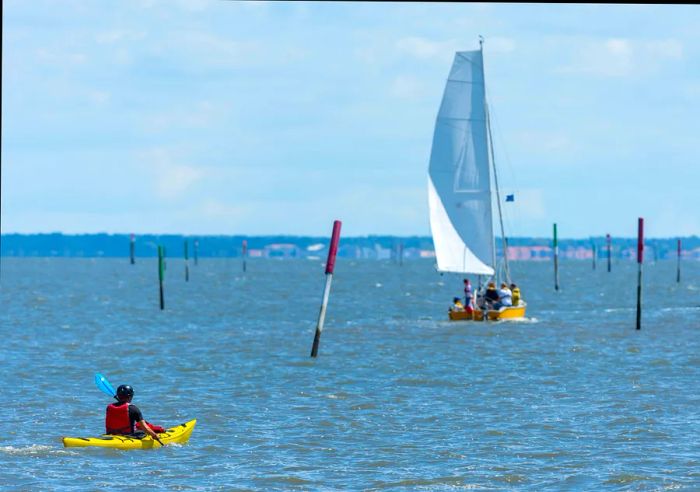 Water sports on the serene waters of Arcachon Bay, Gironde, France.