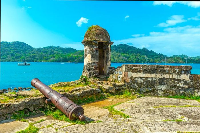 An ancient Spanish cannon rests at the fortress ruins of Santiago, overlooking the Caribbean Sea in Portobelo, near Colon, Panama.