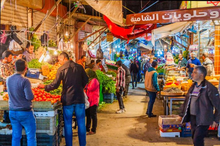 Shoppers at a fruit and vegetable market in Amman, Jordan.