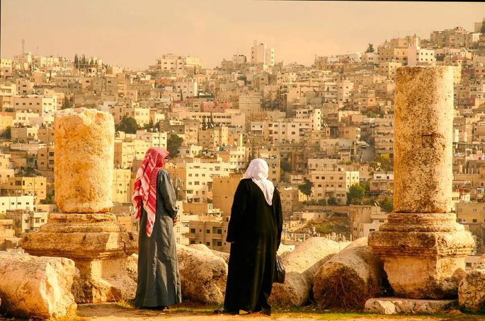 A Jordanian couple takes in the view of Amman from the Citadel Hill, or Jabal al-Qal'a.