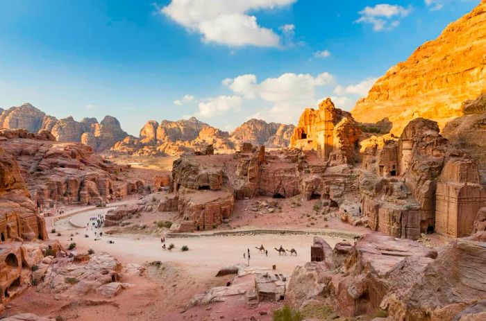 Visitors exploring the ancient ruins of Petra, Jordan