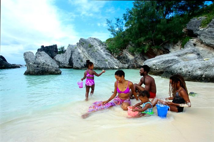 A family enjoying a relaxing day on a Bermuda beach.