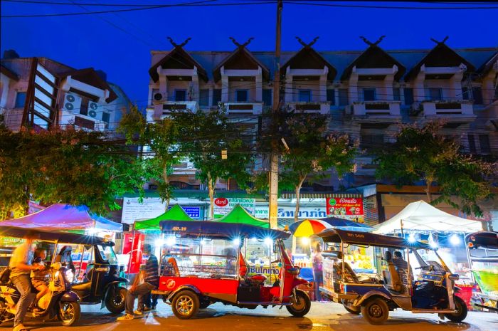 Rickshaws waiting outside the Saturday Night Market in Chiang Mai, Thailand.