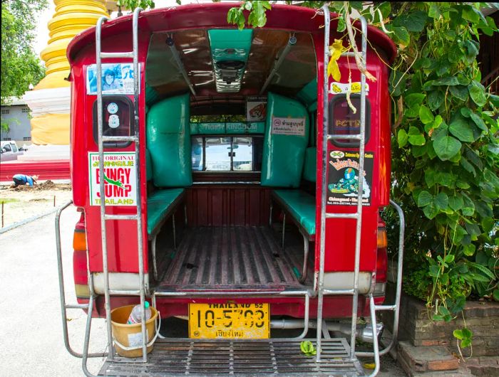 A glimpse inside a red minibus from the back in Chiang Mai, Thailand.