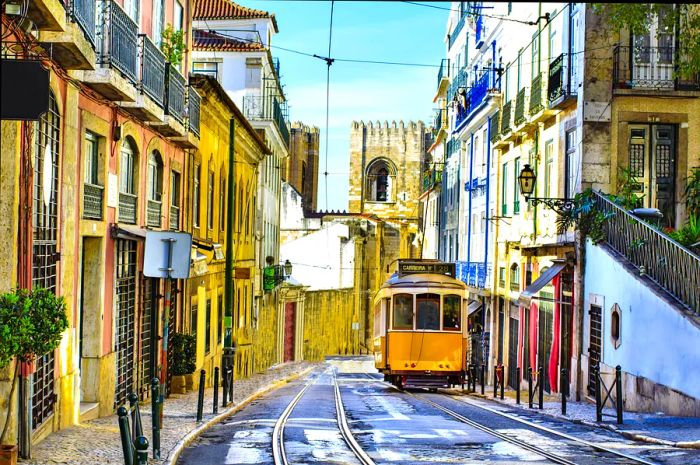 A yellow tram makes its way down a deserted street.