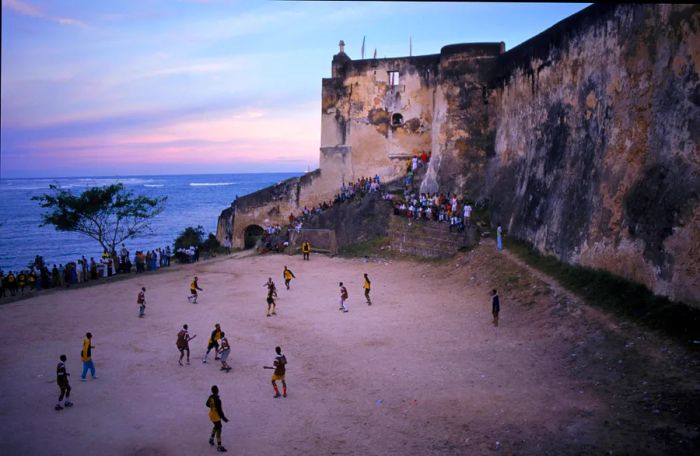 Soccer players at Fort Jesus, Mombasa, Kenya