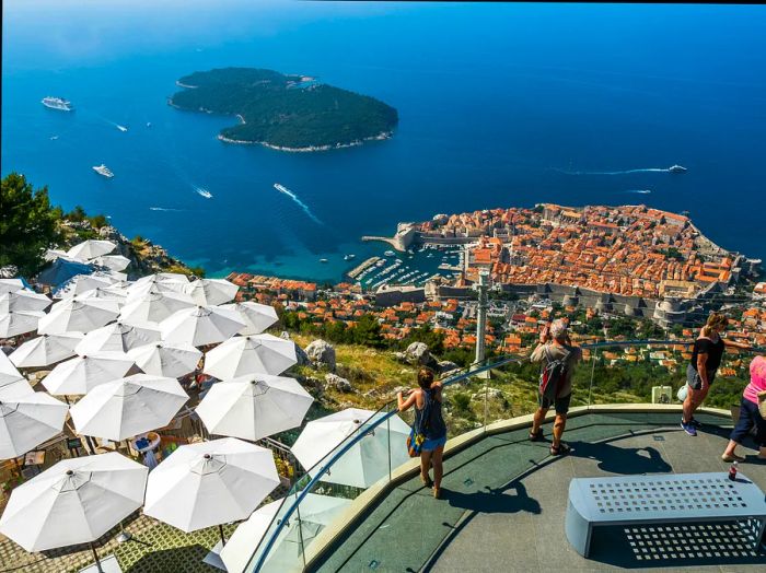 Tourists at the viewpoint on Srd Hill, overlooking Dubrovnik.