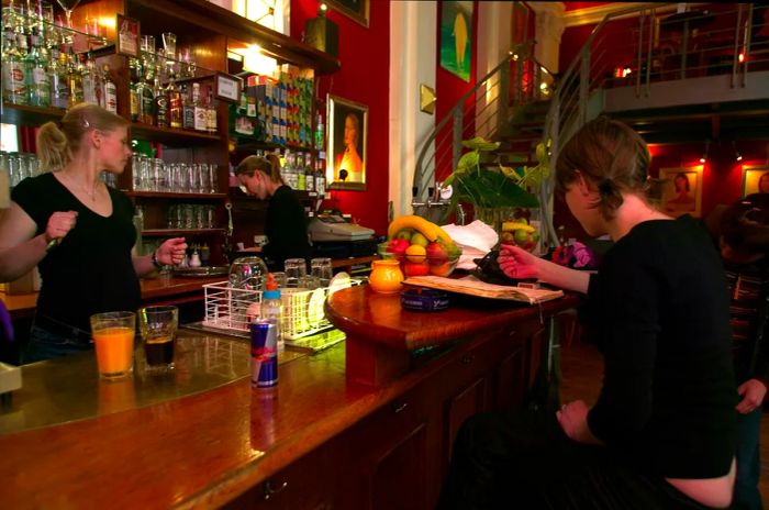 Bartenders and patrons enjoying the atmosphere at the Globe Bookshop Café