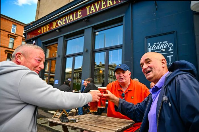 Members of the public savor their first drink in a beer garden at the Rosevale Tavern in Partick on July 06, 2020, in Glasgow, Scotland.