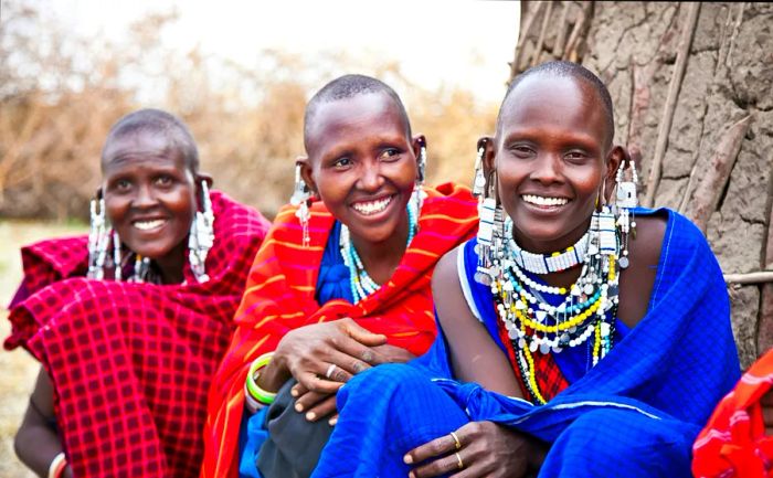 Masai women adorned in traditional jewelry in Tanzania.