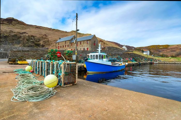 Fishing boat docked in the harbor at Lybster on Scotland's east coast.