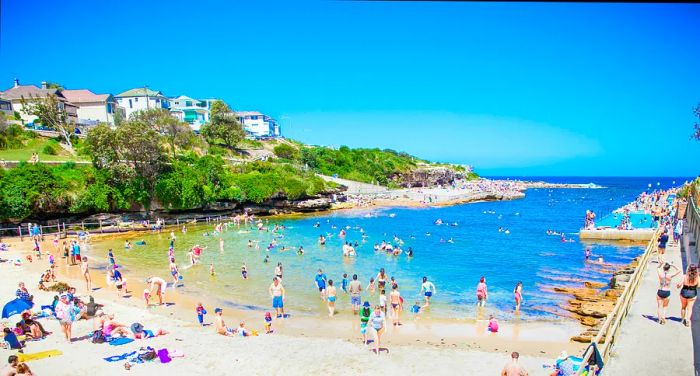 Families enjoy a day at Clovelly Beach in Sydney