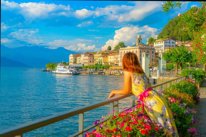 A woman enjoying the sunset over Lake Como and the charming old town of Bellagio, Italy.