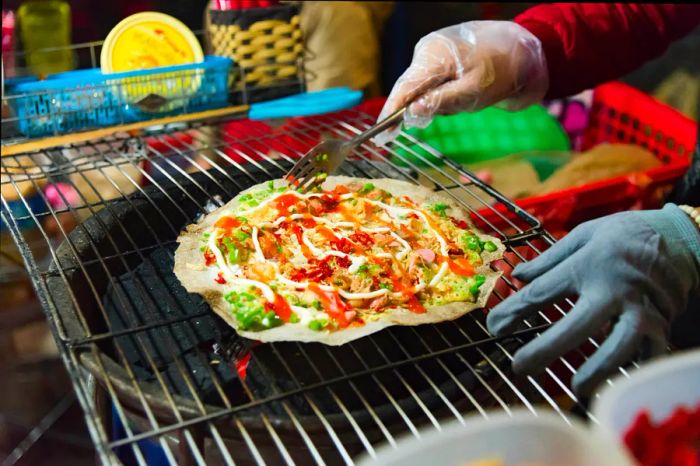 Street food at a night market in Ho Chi Minh City, Vietnam