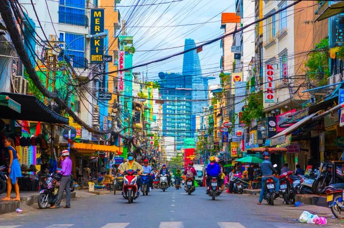 Scooters navigating Bui Vien St, Ho Chi Minh City, Vietnam