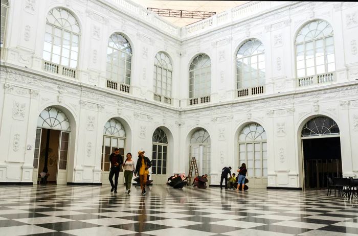 Visitors strolling through an exhibit at the Museum of Art, Lima