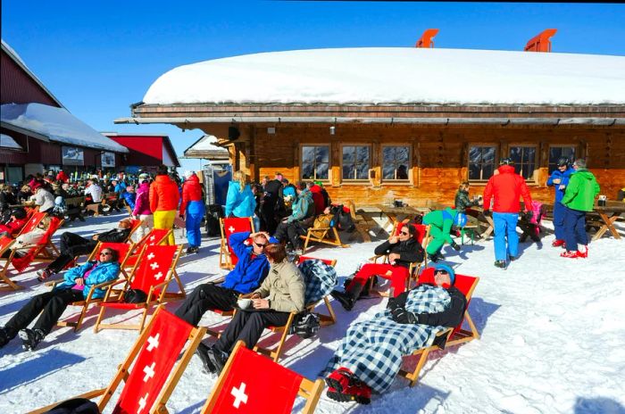 Skiers enjoy a break on deckchairs at the restaurant on Mount Titlis.