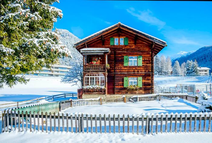 Charming wooden chalet in Davos, Switzerland, on a sunny winter day.