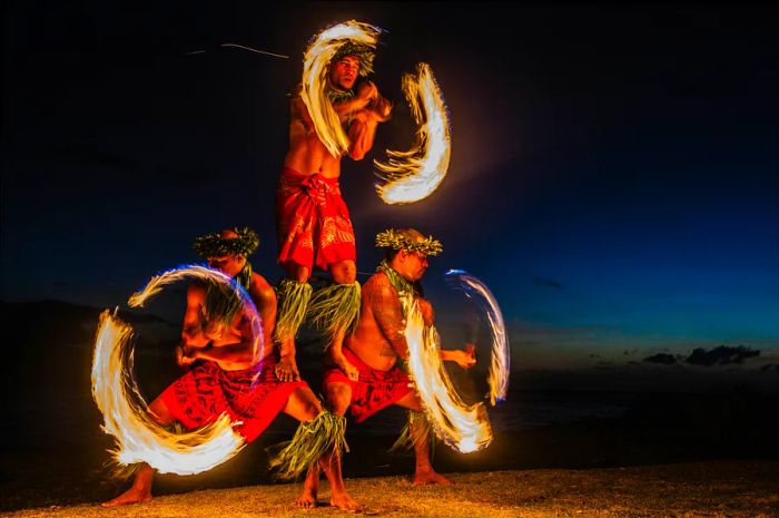 Three Strong Men Performing Fire Juggling in Hawaii: Fire Dancers