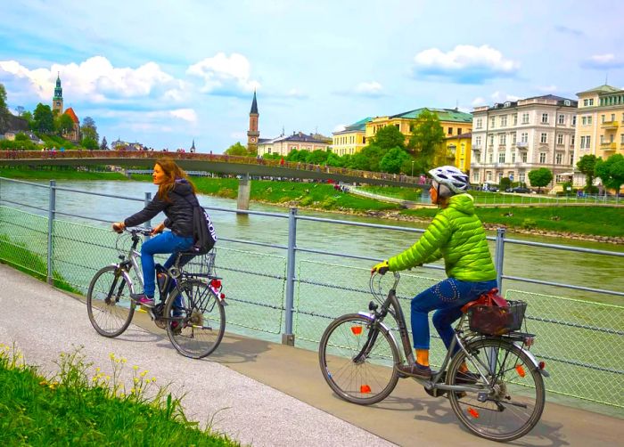 A cyclist enjoys the embankment in Salzburg