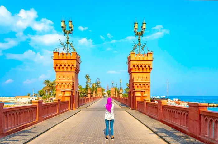 A woman stands on Montaza Bridge in Alexandria, Egypt