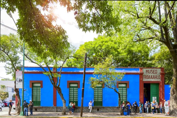 Visitors outside the Blue House (La Casa Azul), a historic residence and art museum dedicated to the life and work of Mexican artist Frida Kahlo