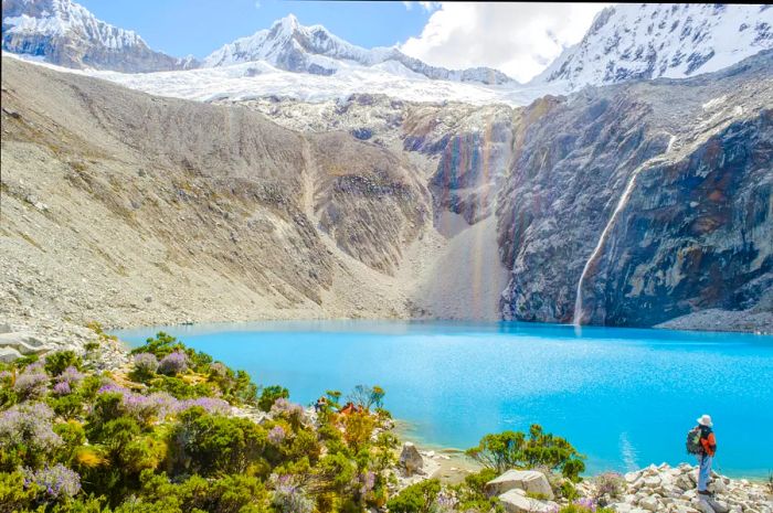 Hiker in front of Laguna 69, Huascarán National Park