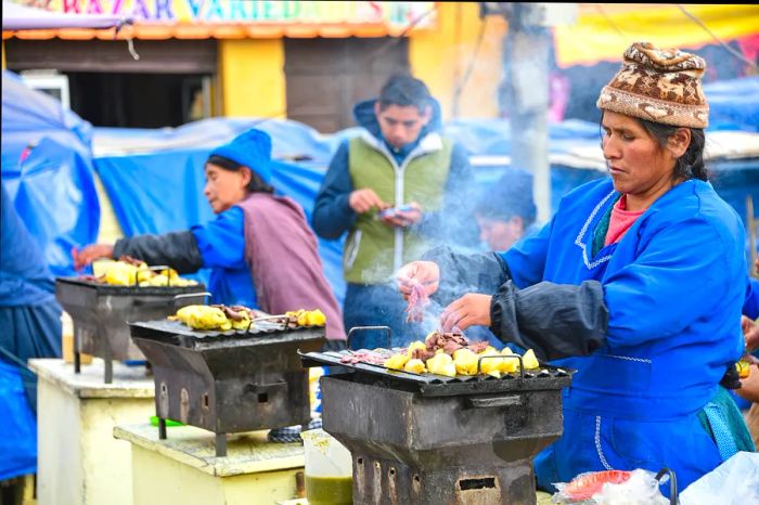 A woman preparing meat and potatoes at a street food stall in Potosi