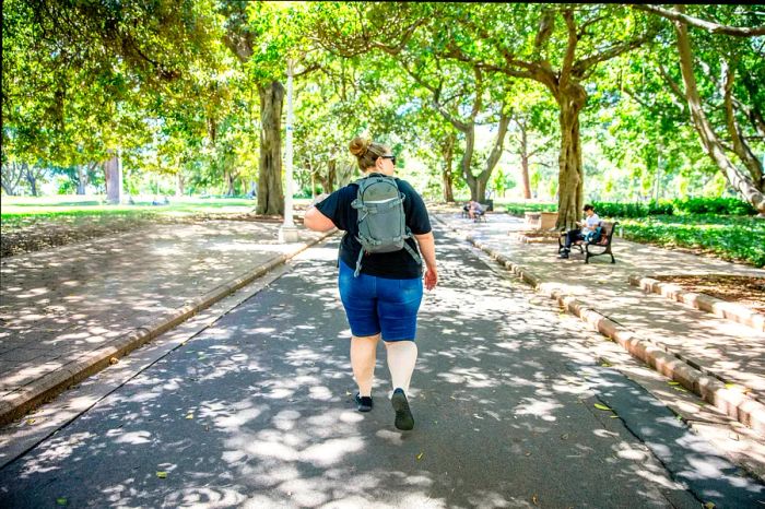 A mature woman exploring Sydney solo, relishing her time alone in the city