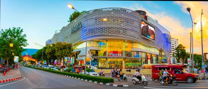 Unidentified individuals stroll along the iconic street in Chiang Mai City, in front of the MAYA shopping center