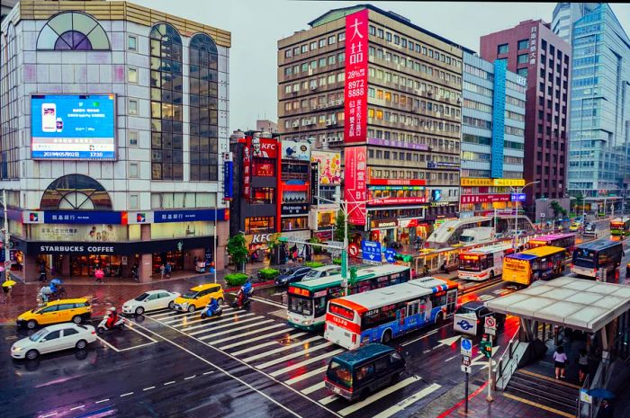 Aerial view of traffic and buses bustling through downtown Taipei, Taiwan