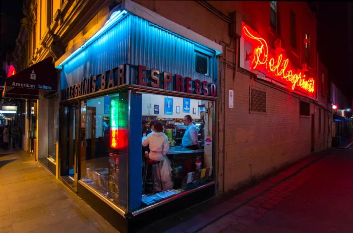 Visitors enjoying coffee at Pellegrini's, a legendary espresso bar located on Bourke Street in the heart of Melbourne, Australia.