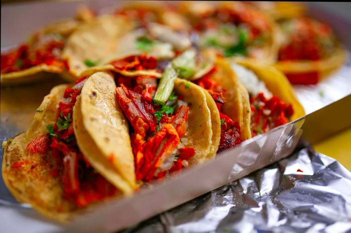 A close-up shot of tacos al pastor