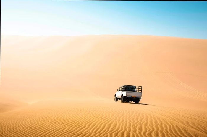 Driving a 4x4 pick-up on sand dunes in Namibia