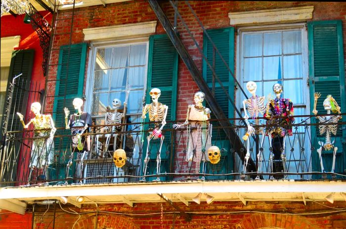 Skeletons decorate a balcony in the French Quarter of New Orleans, Louisiana, USA