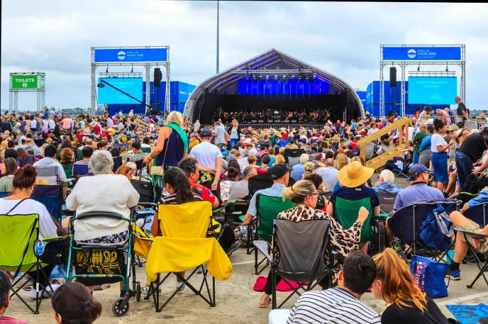 A vibrant crowd enjoying a performance by the Auckland Symphony Orchestra during the Auckland Anniversary Weekend