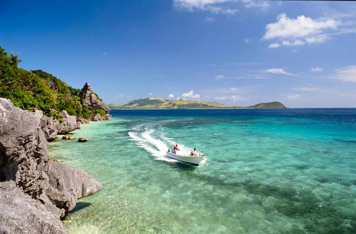 Fiji, Yasawa Island, people in a boat on the ocean