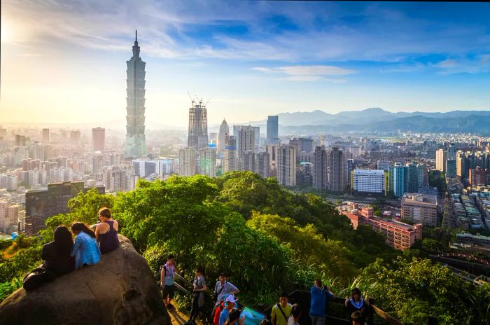 Visitors enjoying the view of Taipei City from the summit of Elephant Mountain