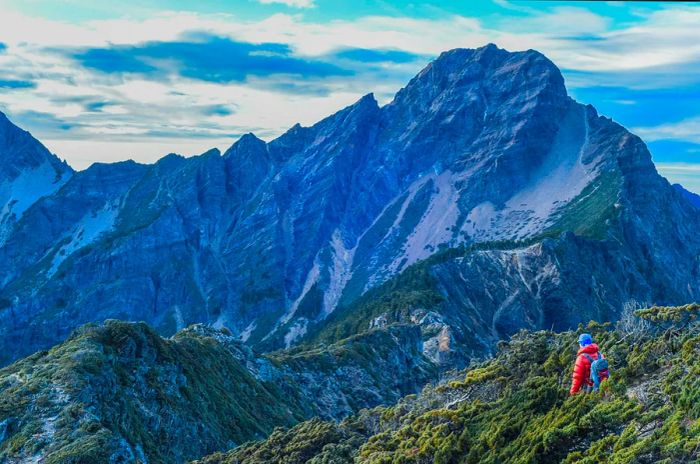 A hiker at sunrise on Yushan mountain, Taiwan