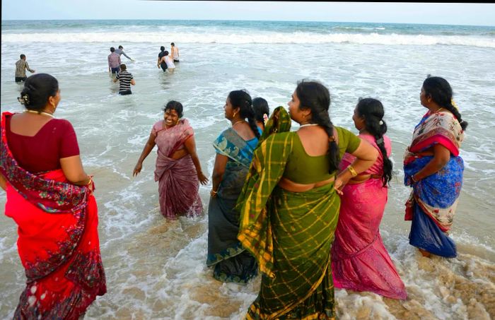 Women enjoying the beach at Mahabalipuram, Tamil Nadu, India.