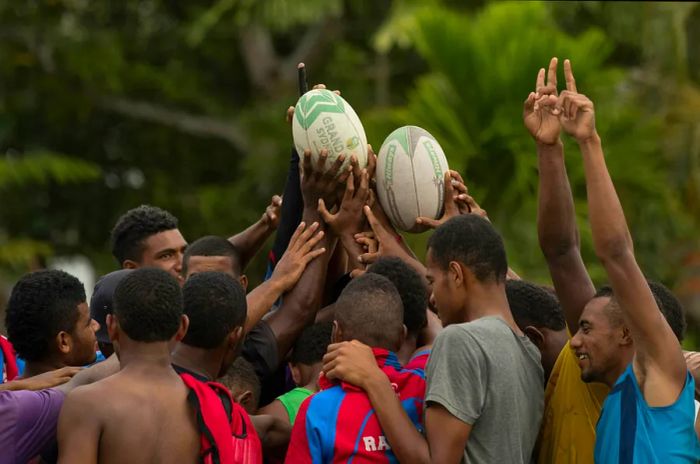 The Korolevu Ruggers team gathers in prayer after their Fiji National Rugby League western conference match against the Korolevu Ruggers boys under 18 team