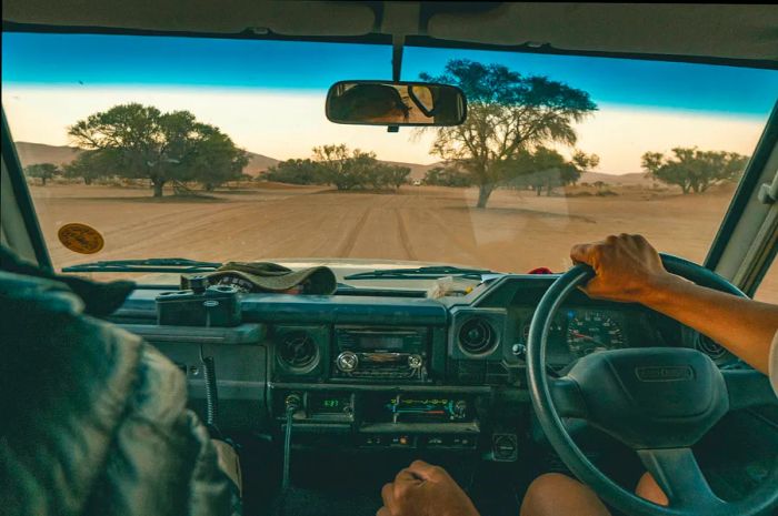 Driving off-road in a 4x4 through the sand dunes