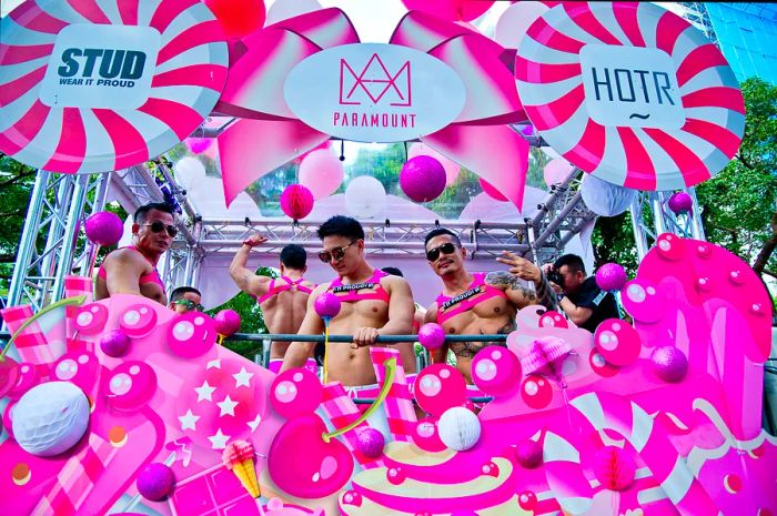 Participants celebrate on a pink float during the annual LGBTIQ+ festival, Taiwan Pride.