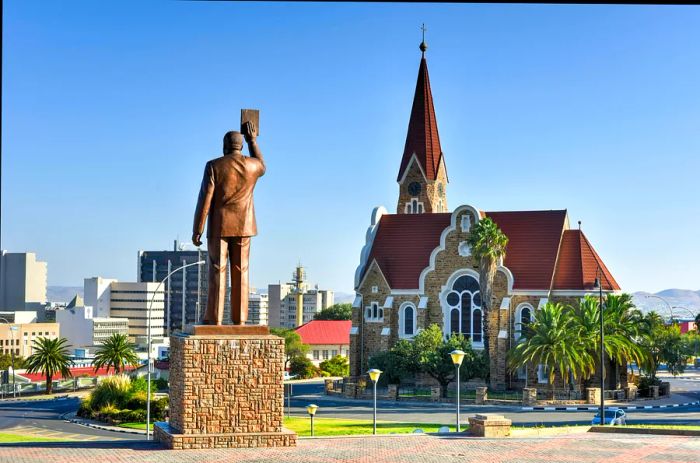 A city featuring a church and a prominent statue