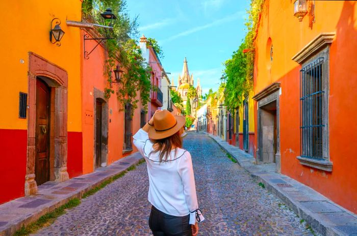 A woman admiring the parish church in San Miguel de Allende, Mexico