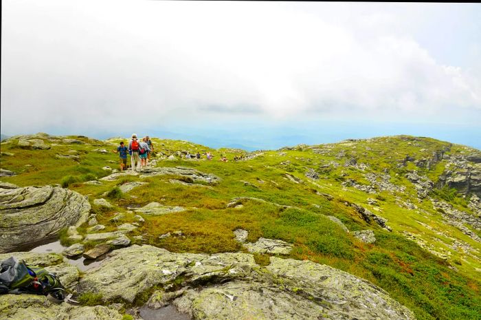 Hikers savoring the breathtaking views along the Sunset Ridge Trail